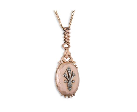A LATE VICTORIAN ANTIQUE ROLLED GOLD PHOTO LOCKET, and bail, applied seed pearl decoration, ca 1900, with later rolled gold f