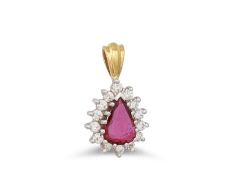 A RUBY AND DIAMOND CLUSTER PENDANT, the pear shaped ruby to a brilliant cut diamond surround, mounted in white and yellow gol