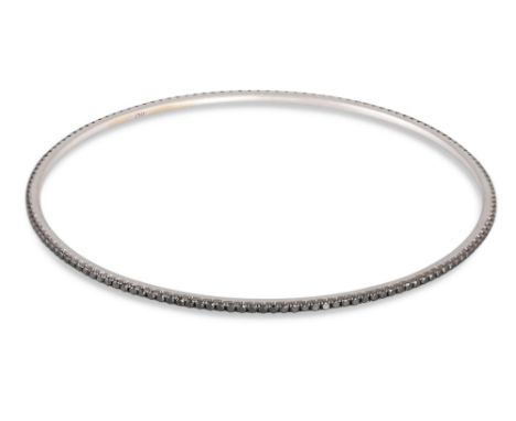 A BLACK DIAMOND BANGLE, in 18ct white gold. Estimated: weight of diamonds: 1.60 ct