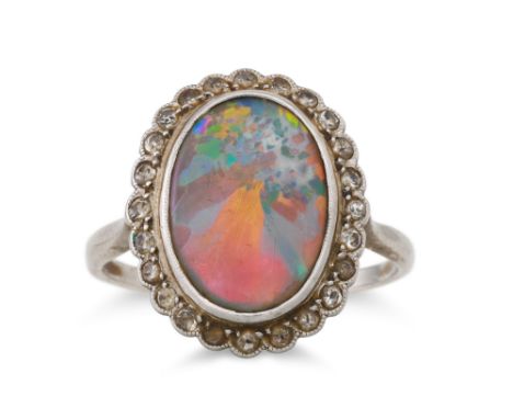 A DIAMOND AND OPAL RING, the oval opal to a old cut diamond surround, mounted in platinum, size O