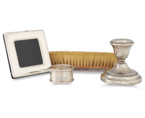 AN IRISH SILVER GLENISHEEN 1973 HALLMARKED NAPKIN RING, together with silver desk candlesticks, a silver back clothes brush a