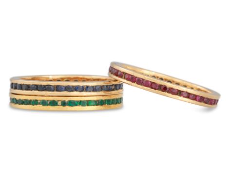 A SET OF THREE GOLD RINGS, set with emerald, ruby and sapphire