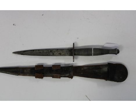 A WW2 pattern 3 Fairbairn Sykes Commando fighting knife with faint markings to the pommel and in the correct scabbard. Knife 