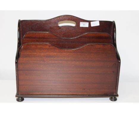 A vintage mahogany magazine rack 