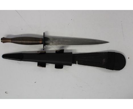 An unusual Fairbairn Sykes post war brass handled pattern 3 Commando fighting knife by R. Cooper (rare maker) in correct shea