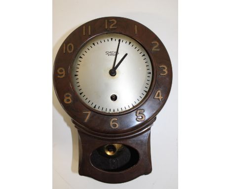 A vintage Smith's bakelite clock (at fault) 26cm in length 