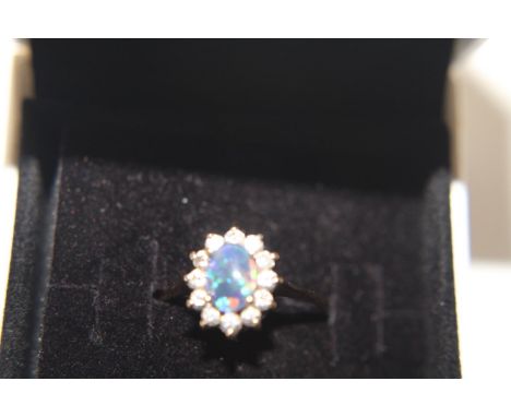 A 9ct gold opal cluster ring size M 