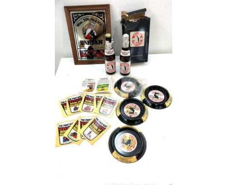 Selection of vintage Brewimania to include Guinness fact books, Guinness ash trays and an advertising mirror measures approx 