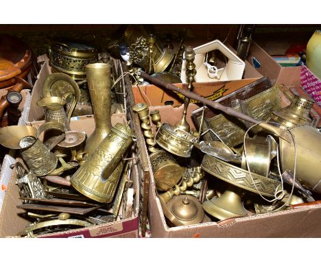 FOUR BOXES OF BRASS WARES, to include candlesticks, lamp bases, trivets, jugs, bells, teapot, log basket, coal scuttle etc