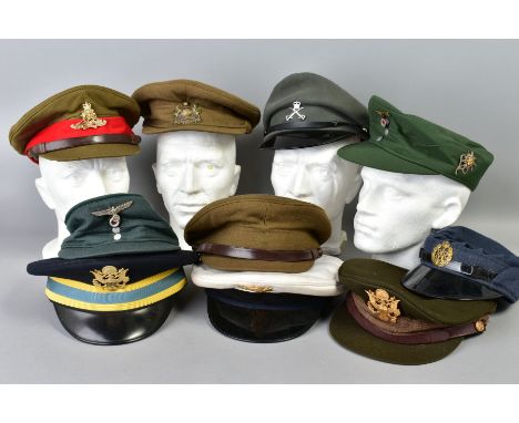 A BOX OF TEN MILITARY CAPS, to include 3rd Reich German (copy), US Army, Navy, RA, and a nice WWI/WWII era British Cap with M