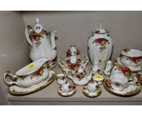 A QUANTITY OF ROYAL ALBERT OLD COUNTRY ROSES, including minature tea for two set, a sauce boat on stand, a coffee pot on stan