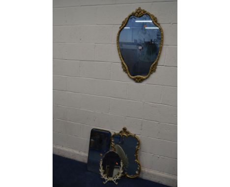 A LATE 20TH CENTURY FOLIATE GILT METAL SHAPED WALL MIRROR, 54cm x 86cm together with a similar gilt on plaster mirror, metal 