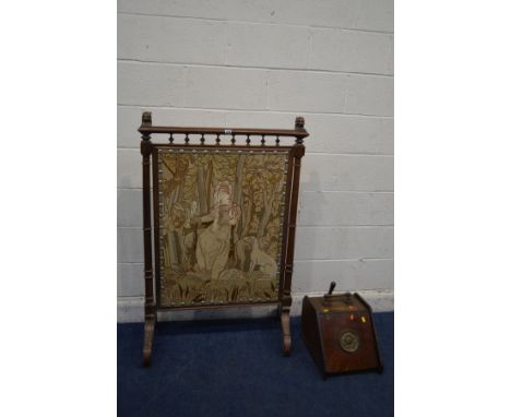 A LARGE EARLY 20TH CENTURY OAK FIRE SCREEN, with lion head's to top rail, turned and fluted upright's on scrolled legs and la