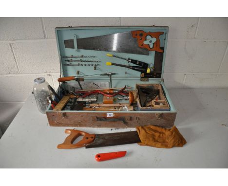 A CARPENTERS TOOLBOX containing hand tools including Spear and Jackson saws, a Footprint wood plane, Stanley and Footprint ch