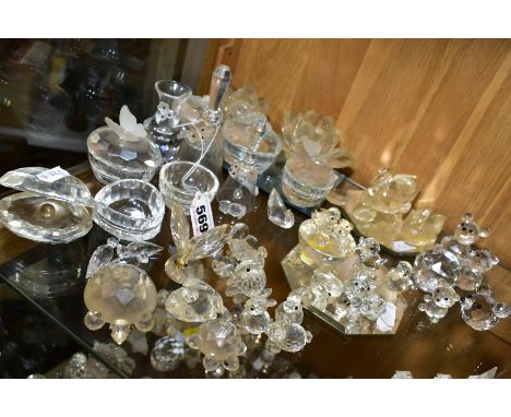 A COLLECTION OF SWAROVSKI CRYSTAL BELLS, ANIMALS, TRINKET BOXES ETC, including four swans on a mirrored stand, an oyster with