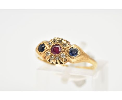 AN EARLY 20TH CENTURY 18CT GOLD GEM SET RING, designed with a circular cut ruby within a single cut diamond surround, flanked