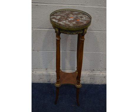 A LATE 20TH CENTURY CIRCULAR MARBLE TOPPED AND WALNUT TORCHERE STAND, with a brass gallery and foliate mounts, diameter 31cm 