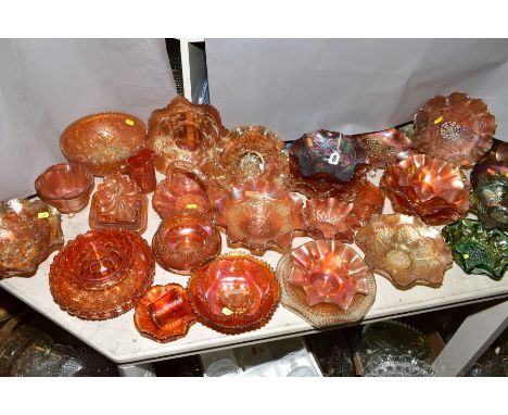 A COLLECTION OF CARNIVAL GLASS, orange, green and amethyst including grapes and vine (green), Acorn and Oak leaves (amethyst)