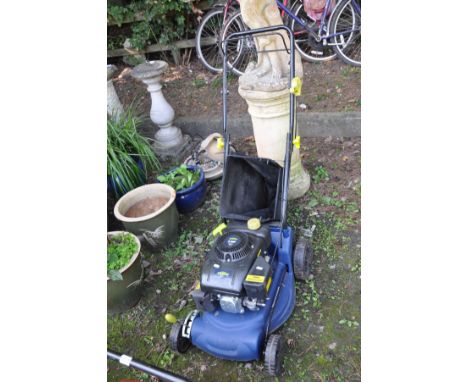 A CHALLENGE XTREME PETROL LAWN MOWER with a 3.5hp four stroke engine and grass collection bag (engine pulls freely but not st