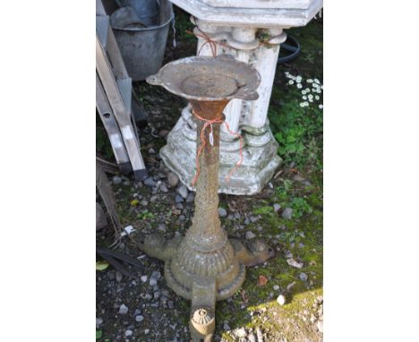 AN AESTHETIC MOVEMENT STYLE CAST IRON TABLE BASE with pyramid stud detail down to central column, fluted dome base concluding