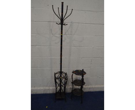A BLACK CAST IRON THREE TIER STAND, together with a modern metal coat stand (2)