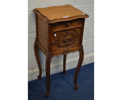 AN EARLY 20TH CENTURY CARVED WALNUT POT CUPBOARD, with a single drawer, ceramic interior, on cabriole legs, width 43cm x dept