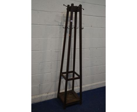 AN EARLY 20TH CENTURY ARTS AND CRAFTS OAK SQUARE TAPERING HALL STAND, with multiple brass hooks, 38cm squared x height 138cm 