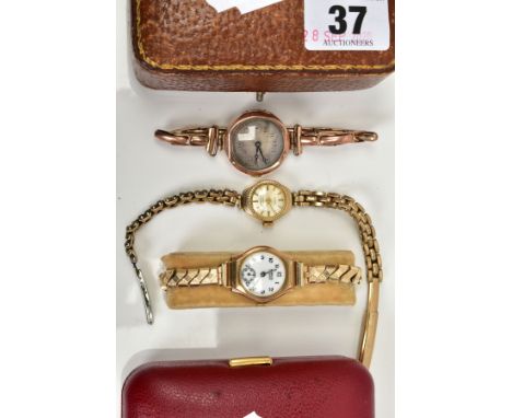 THREE LADIES GOLD WRISTWATCHES, to include a silver engine turned design dial, Arabic numerals, blue hands, with a 9ct hallma