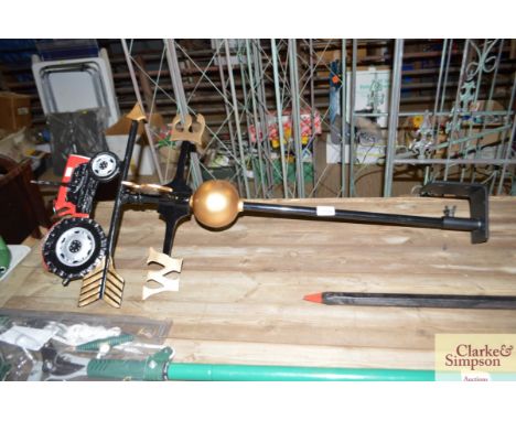 A weather vane decorated with a tractor