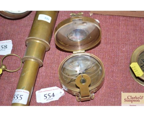 A reproduction brass cased compass