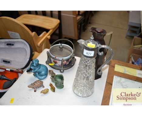 A quantity of decorative china to include Wade Whimsy's; a Poole Otter; a claret jug etc