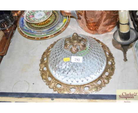 A brass and glass light fitting