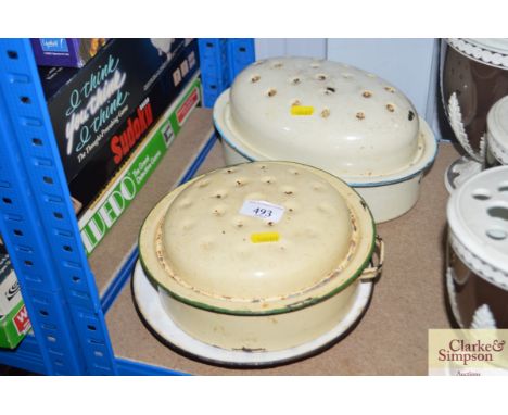 Two enamel cooking dishes and a plate