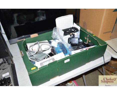 A box containing a portable speaker; various mobile phones etc