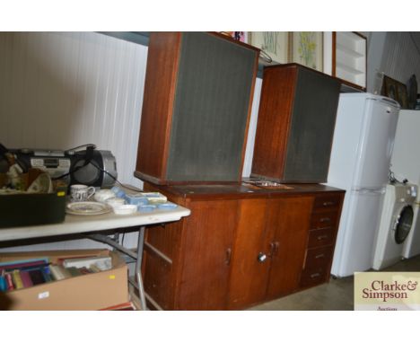 A large music centre housed in sideboard, sold as collectors item