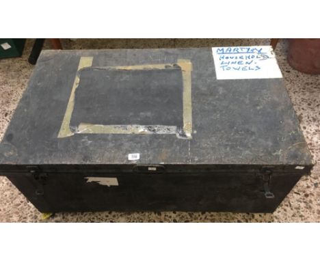 A BLACK OR GREY METAL TROPICAL TRAVEL TRUNK WITH CLIP LATCHES