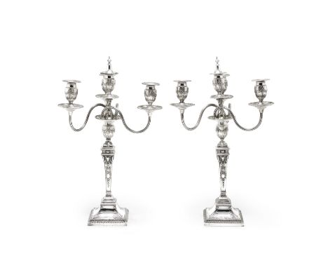 A pair of Victorian silver four-light candelabraJoseph &amp; Horace Savory, London 1885The detachable branch sections with th