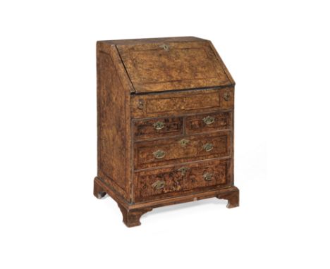 A George I stained field maple ('Mulberry' wood) and featherbanded bureau of small proportionsCirca 1715, the fall enclosing 