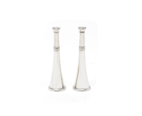 A pair of novelty Victorian silver salt and pepper shakersCarrington &amp; Co, London 1900 Modelled as hunting horns, the mou