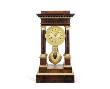 An early 19th Century French gilt brass mounted mahogany portico clock with compensated pendulumthe dial signed Jan Caceaux H