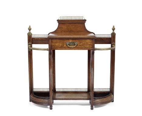 A James Shoolbread brass and oak walking stick hall stand English, late 19th centuryThe central oak drawer fitted with brass 