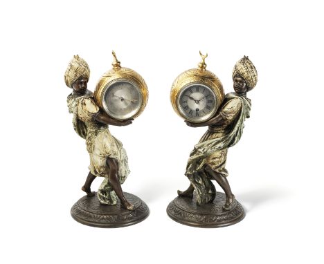 Louis Hottot (French, 1829-1905): A pair of late 19th/early 20th century cold painted and gilt spelter novelty timepiece and 