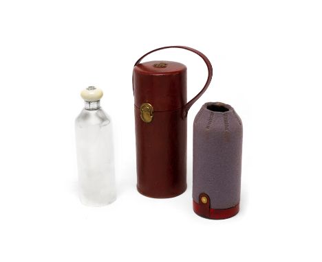 A French silver flask and insulating carrying casemaker's mark 'AL', Paris circa 1890 The flask with ivory twist-off cap, in 