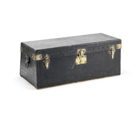 An early 20th century Louis Vuitton brass mounted black leather motoring trunkof rectangular form with sloping back, the lid,