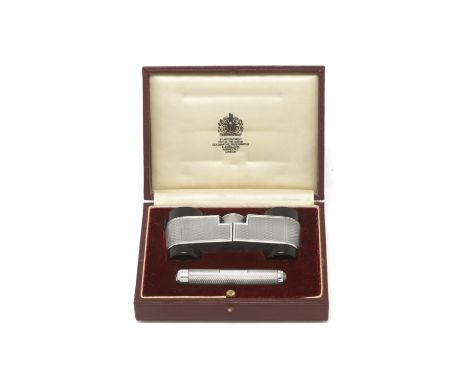 A cased silver-mounted torch and opera glasses setAsprey, London 1985 With engine-turned decoration, in a fitted case, length
