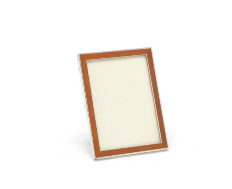 A French silver and enamel photograph frameAndré Delpy, Paris circa 1920 The orange enamel over an engine-turned ground, with