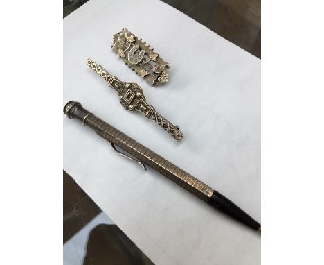 Two silver brooches, Edinburgh 1938, and Birmingham 1875/99, and a sterling propelling pencil 