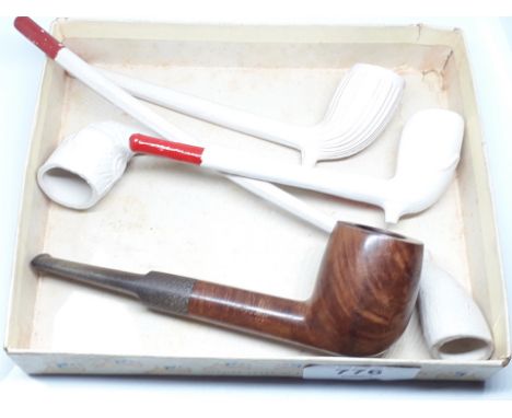A small selection of pipes comprising four clay pipes and a vintage pipe 'Leyland No7'. 