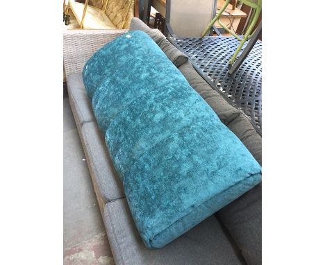 A turquoise pouffe 