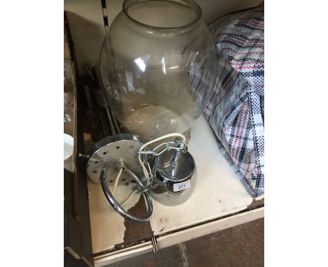 A chromed light fitting with large glass shade. 
